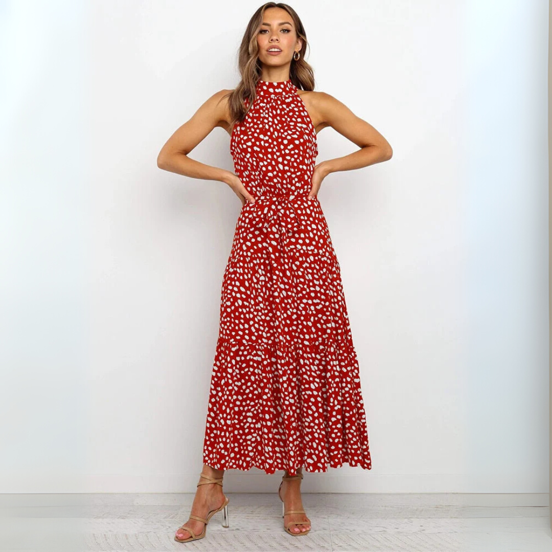 Vestido midi ajustado y acampanado con lunares, detalle de la costura