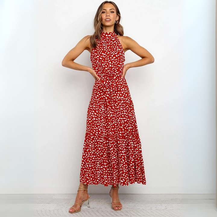 Vestido midi ajustado y acampanado con lunares, detalle de la costura