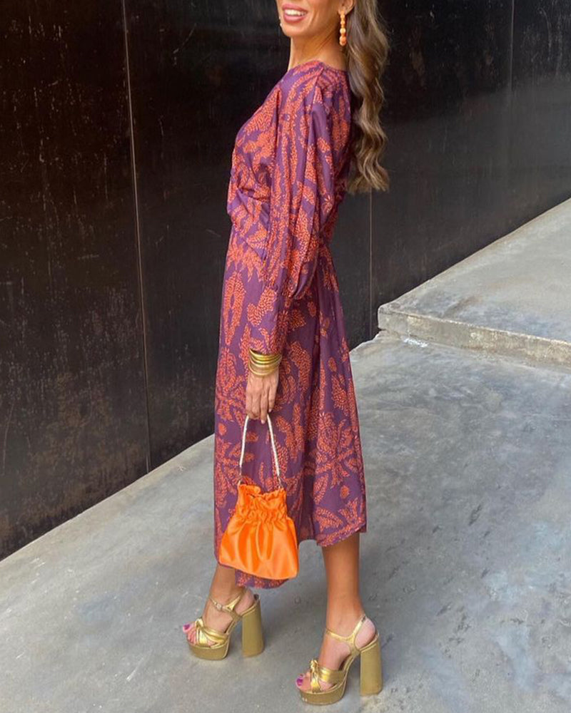 Vestido midi estampado con nudo delantero y escote en V profundo