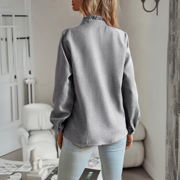 Elegante blusa de manga larga