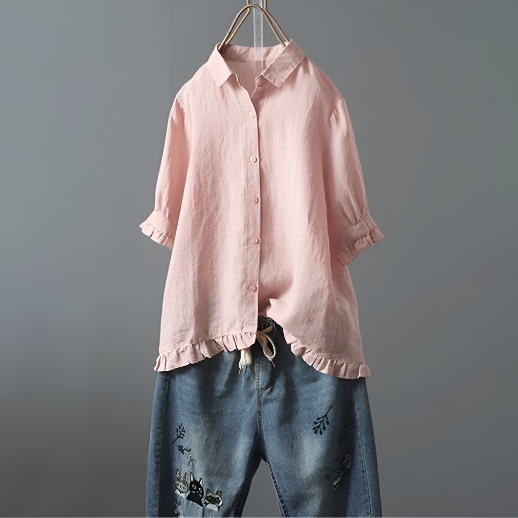 Blusa de algodón abotonada con bajo con volantes